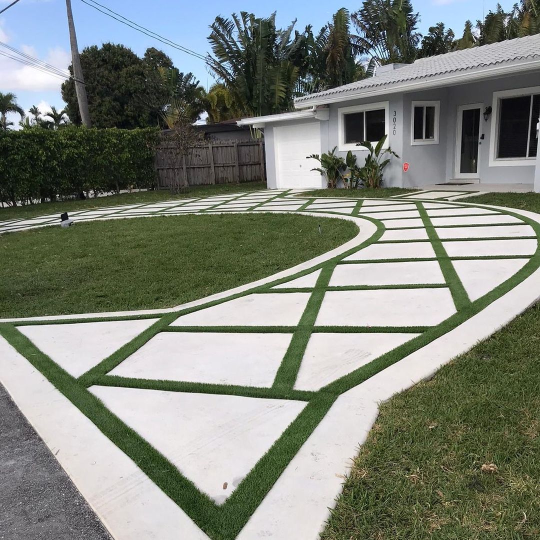 synthetic grass infront of a white house